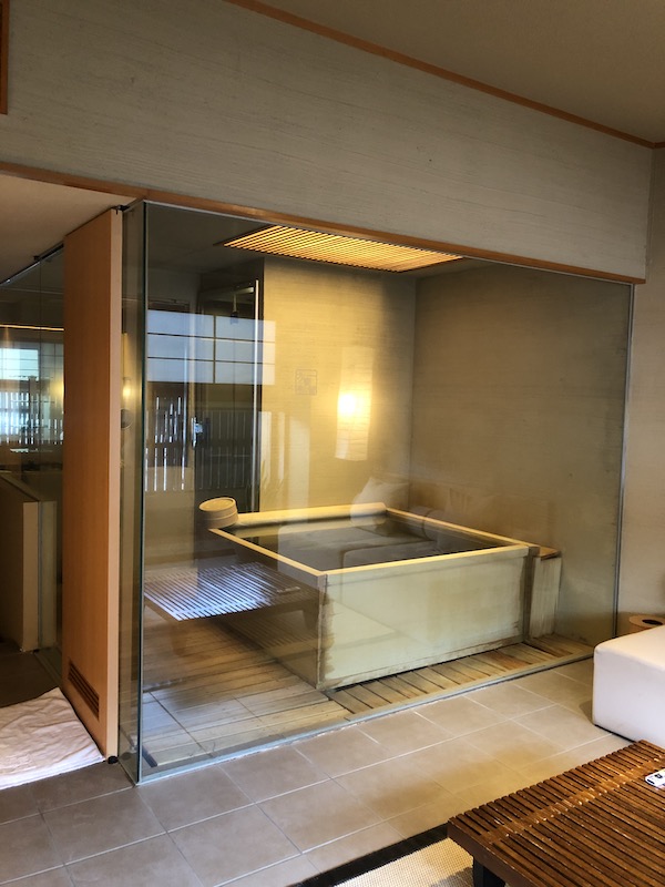 Glass-partition bath photographed in the author's Lake Shikotsu room